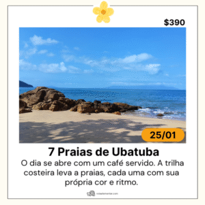 Praia do percurso das 7 Praias de Ubatuba fotografada durante roteiro da Rota Elementar, com faixa de areia clara, mar azul calmo, costão rochoso e vegetação de mata atlântica costeira.