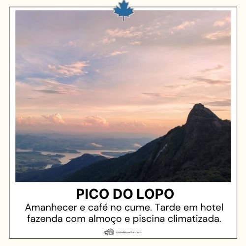 Silhueta do Pico do Lopo durante o nascer do sol com vista para o vale e represa ao fundo sob céu colorido.